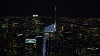 The top of Wilshire Grand Center at night in Downtown Los Angeles, California Aerial Stock Photos | AX0158_113.0000337