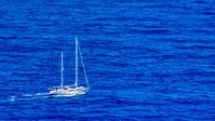 Sail boat in sapphire blue waters, Culebra, Puerto Rico  Aerial Stock Photos | AX102_105.0000100F