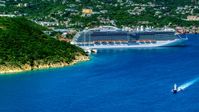 Cruise ship docked at the coastal island town of Charlotte Amalie, St. Thomas  Aerial Stock Photos | AX102_200.0000000F