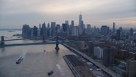Manhattan Bridge and the Lower Manhattan skyline at sunset in New York City Aerial Stock Photos | AX121_027.0000270F