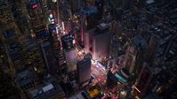 The bright lights and video screens of Times Square at sunset in Midtown, New York City Aerial Stock Photos | AX121_105.0000243F