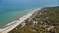 A small town with beachfront homes by Cape Cod Bay, Plymouth, Massachusetts Aerial Stock Photos | AX143_122.0000000