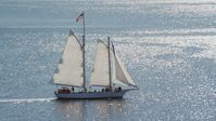 A sailing boat with a crowd of people on Cape Cod Bay, Massachusetts Aerial Stock Photos | AX143_243.0000106