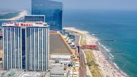 Trump Taj Mahal by the boardwalk and beach in Atlantic City, New Jersey Aerial Stock Photos | AXP071_000_0018F