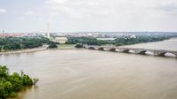 The Washington Monument, Lincoln Memorial, and Arlington Memorial Bridge in Washington DC Aerial Stock Photos | AXP074_000_0011F