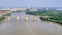 Francis Scott Key Bridge over the Potomac River, Washington Monument in background in Washington DC Aerial Stock Photos | AXP075_000_0017F