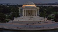Visitors at the Jefferson Memorial, lit up at twilight in Washington, D.C. Aerial Stock Photos | AXP076_000_0037F