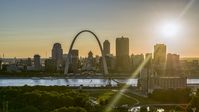 The setting sun behind the Downtown St. Louis, Missouri skyline Aerial Stock Photos | DXP001_028_0001
