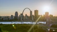 The Arch and Downtown St. Louis, Missouri skyline with setting sun in background Aerial Stock Photos | DXP001_028_0005
