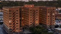 A brick office building at twilight in Kansas City, Missouri Aerial Stock Photos | DXP001_046_0003