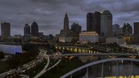 The city skyline at twilight seen from the river and bridges in Downtown Columbus, Ohio Aerial Stock Photos | DXP001_087_0011