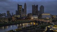 The city skyline across the river at twilight, Downtown Columbus, Ohio Aerial Stock Photos | DXP001_088_0001