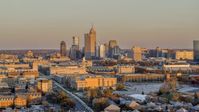 A wide view of the city's downtown skyline at sunset, Downtown Indianapolis, Indiana Aerial Stock Photos | DXP001_092_0011