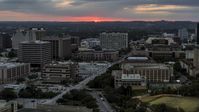 The setting sun behind university campus, Austin, Texas Aerial Stock Photos | DXP002_105_0017