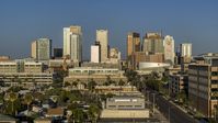 A view of high-rise office buildings of the city's skyline at sunset in Downtown Phoenix, Arizona Aerial Stock Photos | DXP002_143_0002