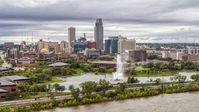 The city's skyline while seen from near a park fountain, Downtown Omaha, Nebraska Aerial Stock Photos | DXP002_169_0009
