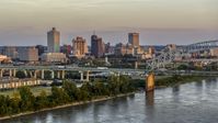 The city's skyline behind the bridge at sunset, Downtown Memphis, Tennessee Aerial Stock Photos | DXP002_181_0002