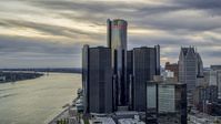A towering riverfront skyscraper at sunset, Downtown Detroit, Michigan Aerial Stock Photos | DXP002_192_0008