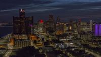The brightly lit city skyline at twilight in Downtown Detroit, Michigan Aerial Stock Photos | DXP002_198_0004