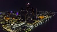 The GM Renaissance Center by the river at night, Downtown Detroit, Michigan Aerial Stock Photos | DXP002_199_0004