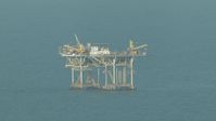 HD stock footage aerial video of flying by an oil platform in the Gulf of Mexico Aerial Stock Footage | AF0001_000168