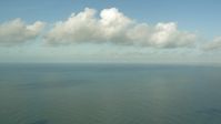 HD stock footage aerial video of flying over the Gulf of Mexico with a view of clouds near Matagorda Peninsula, Texas Aerial Stock Footage | AF0001_000170