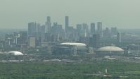 HD stock footage aerial video of NRG Stadium, Houston Astrodome, and the city skyline of Downtown Houston, Texas Aerial Stock Footage | AF0001_000252
