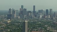 HD stock footage aerial video of a view of the city skyline, and zoom in closer, Downtown Houston, Texas Aerial Stock Footage | AF0001_000257