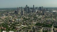 HD stock footage aerial video of a view of the city skyline, and zoom to a closer view, Downtown Houston, Texas Aerial Stock Footage | AF0001_000260