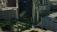 HD stock footage aerial video zoom out to reveal Heritage Plaza, and zoom in on a church in Downtown Houston, Texas Aerial Stock Footage | AF0001_000271