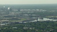 HD stock footage aerial video flyby warehouses by the Buffalo Bayou, the 610 bridge, and an oil refinery in Harrisburg, Manchester, Texas Aerial Stock Footage | AF0001_000275