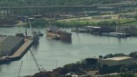 HD stock footage aerial video of tugboats pushing an oil tanker through Buffalo Bayou in Harrisburg, Manchester, Texas Aerial Stock Footage | AF0001_000276