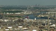 HD stock footage aerial video oil refineries around Buffalo Bayou in Harrisburg, Manchester, Texas, Downtown Houston skyline in background Aerial Stock Footage | AF0001_000283