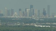 HD stock footage aerial video of a view of the distant skyline of Downtown Houston, Texas Aerial Stock Footage | AF0001_000298