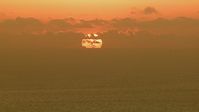 HD stock footage aerial video of the sun rising behind clouds over the Gulf of Mexico Aerial Stock Footage | AF0001_000337
