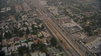HD stock footage aerial video of a reverse view of homes by San Fernando Road in Sylmar, California Aerial Stock Footage | AF0001_000352