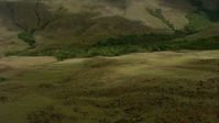 HD stock footage aerial video fly over hilly savanna to approach jungle at the base of a mountain in Southern Venezuela Aerial Stock Footage | AF0001_000538