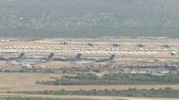 HD stock footage aerial video of a view of airplanes at an aircraft boneyard, Davis Monthan AFB, Tucson, Arizona Aerial Stock Footage | AF0001_000850