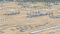 HD stock footage aerial video pan across aircraft parked at the boneyard at Davis Monthan AFB, Tucson, Arizona Aerial Stock Footage | AF0001_000853