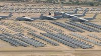 HD stock footage aerial video of military airplanes of various sizes at the base's aircraft boneyard, Davis Monthan AFB, Tucson, Arizona Aerial Stock Footage | AF0001_000863