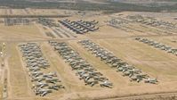HD stock footage aerial video of various military airplanes at the base's aircraft boneyard, Davis Monthan AFB, Tucson, Arizona Aerial Stock Footage | AF0001_000864