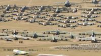 HD stock footage aerial video of reverse view of military airplanes at an aircraft boneyard, Davis Monthan AFB, Tucson, Arizona Aerial Stock Footage | AF0001_000867
