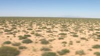 HD stock footage aerial video flyby desert vegetation in a wide plain in New Mexico Aerial Stock Footage | AF0001_000903