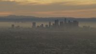 5K stock footage aerial video of the Downtown Los Angeles skyline at a hazy sunset, California Aerial Stock Footage | AF0001_000984