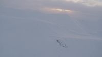 4K stock footage aerial video snow covered mountains, clouds, Chugach Mountains, Alaska, sunset Aerial Stock Footage | AK0001_0079