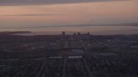 4K stock footage aerial video approaching Merrill Field and Downtown Anchorage, Alaska, sunset Aerial Stock Footage | AK0001_0103