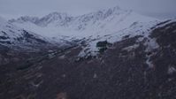 4K stock footage aerial video fly over foothills, approach snow covered peaks, Chugach Mountains, Alaska, twilight Aerial Stock Footage | AK0001_0186