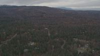 4K stock footage aerial video flying over forested foothills, approaching neighborhood, Anchorage, Alaska Aerial Stock Footage | AK0001_0342