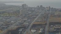 4K stock footage aerial video flying by East 5th Avenue, tilt up, revealing Downtown Anchorage, Alaska Aerial Stock Footage | AK0001_0583