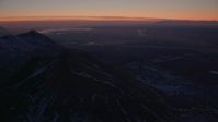 4K stock footage aerial video Anchorage seen from the snow covered Chugach Mountains at twilight, Alaska Aerial Stock Footage | AK0001_1131